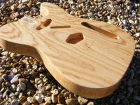 Clear nitrocellulose lacquer on swamp ash&nbsp;&copy;&nbsp;2026&nbsp;Guitar Angel